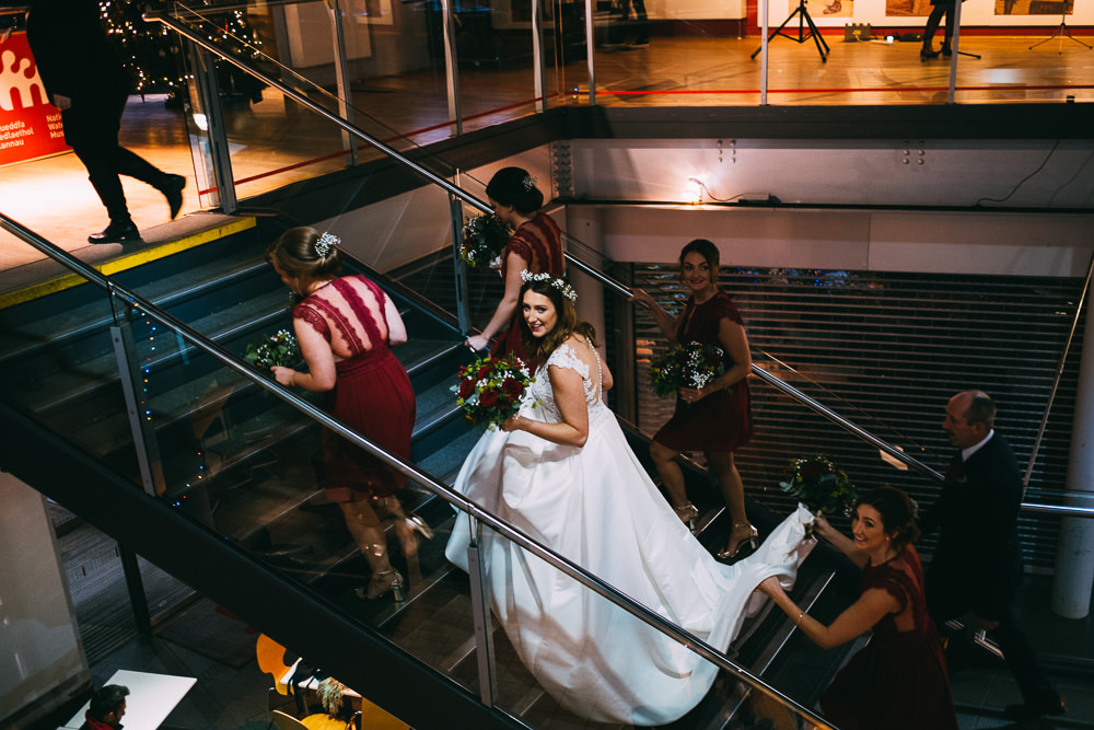 001 BRIDE BRIDESMAIDS MAKING BRIDAL ENTRANCE NATIONAL WATERFRONT MUSEUM WEDDING PHOTOGRAPHY SWANSEA
